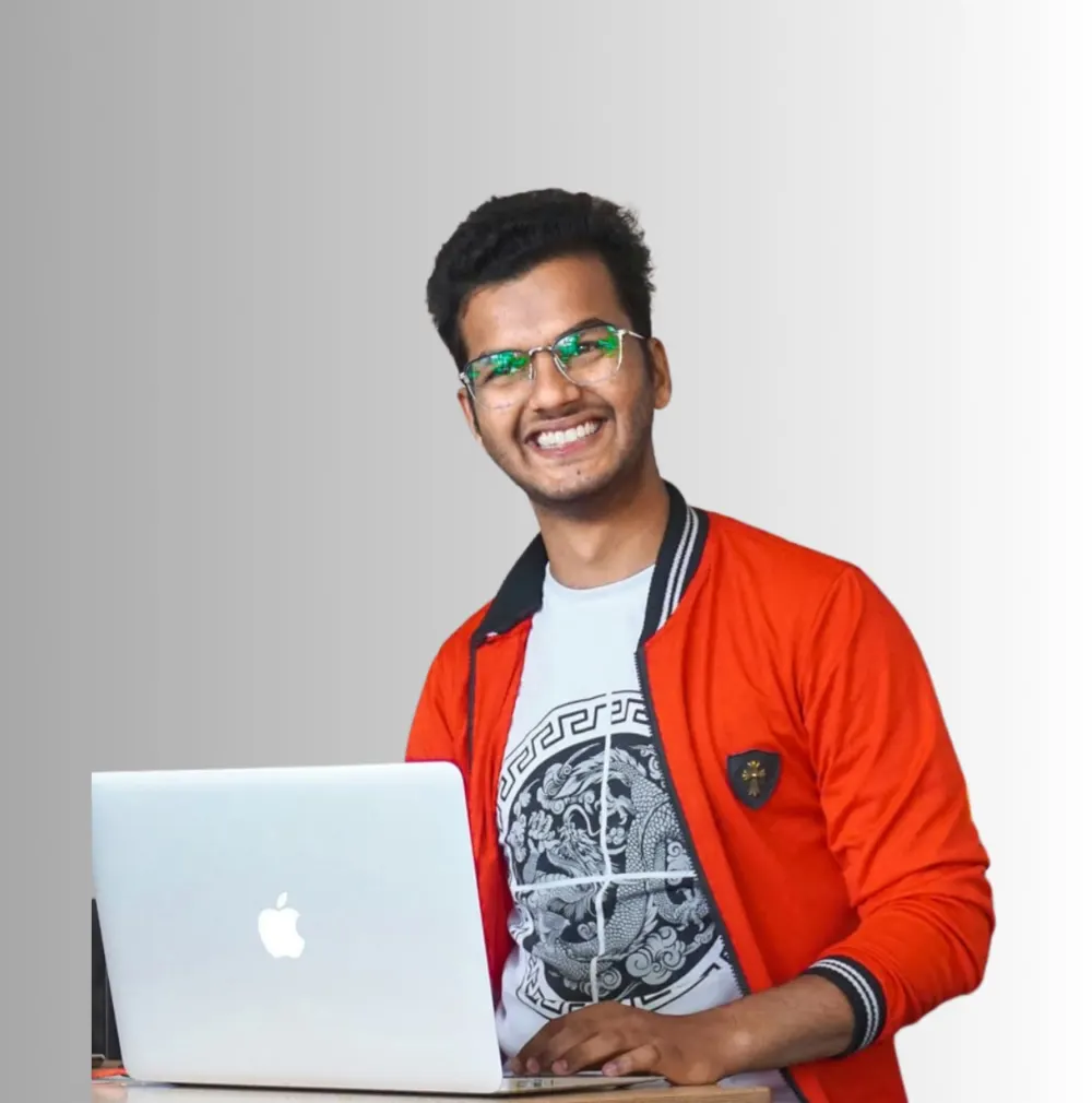 Anand Verma working on a laptop